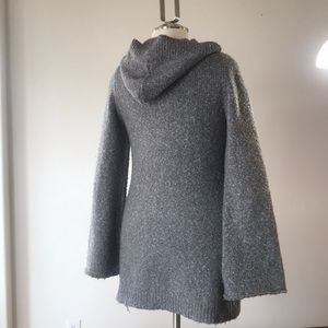 Prana grey sweater with hood and bell sleeves.